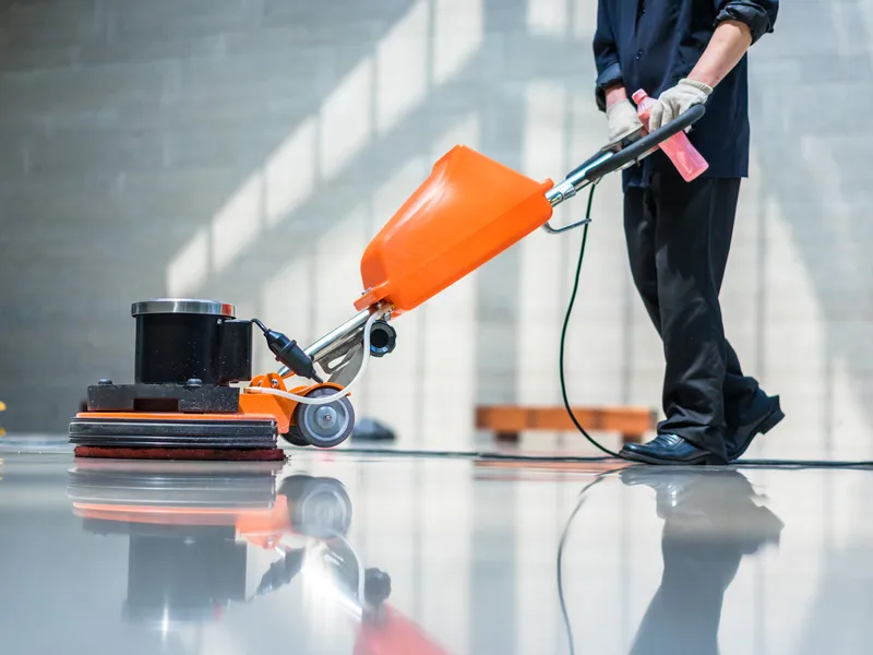 Janitor Maintaining Tile And Hardwood Floors